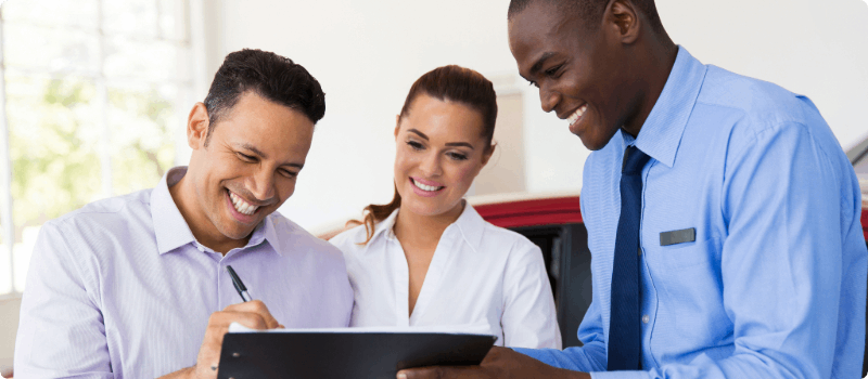 Auto buying signing a contract.