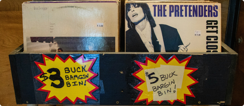 A bin of old records for sale.