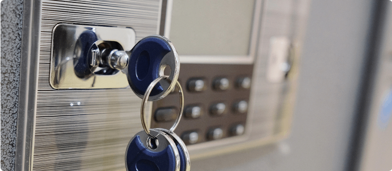 Safe with keys and a digital keypad.