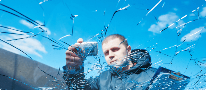 Insurance agent documenting vehicle damage.