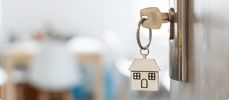 House keys in an ajar front door.