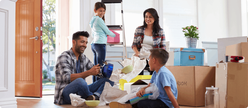 Happy family moving into a new home.