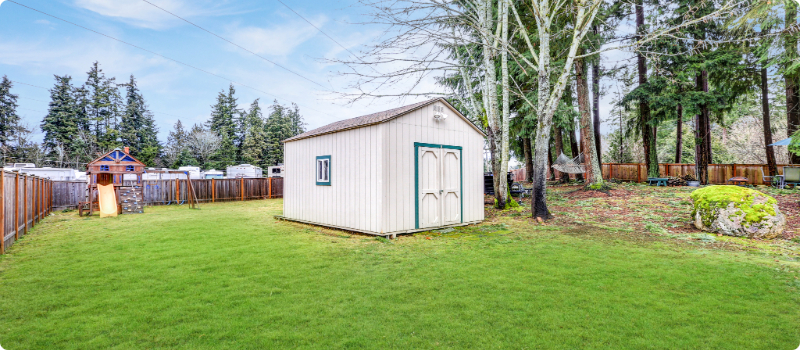 A new shed in a backyard.