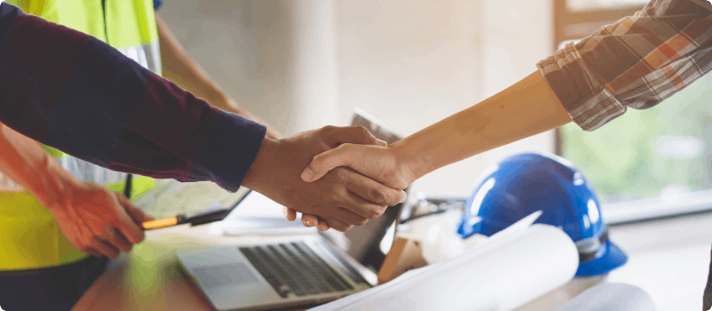 Two people shaking hands.