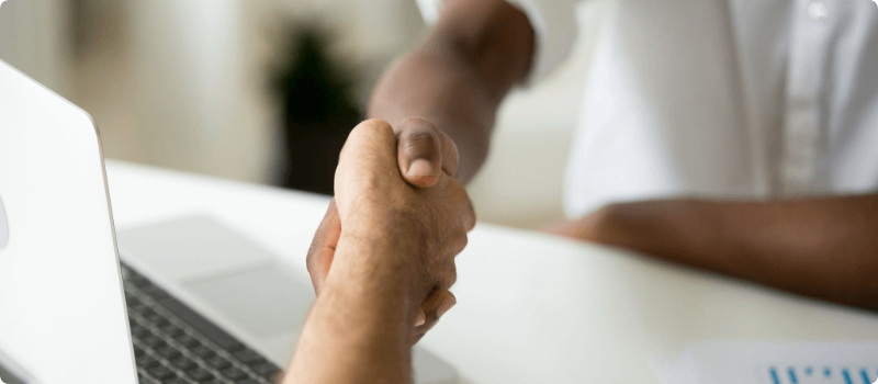 Two people shaking hands.