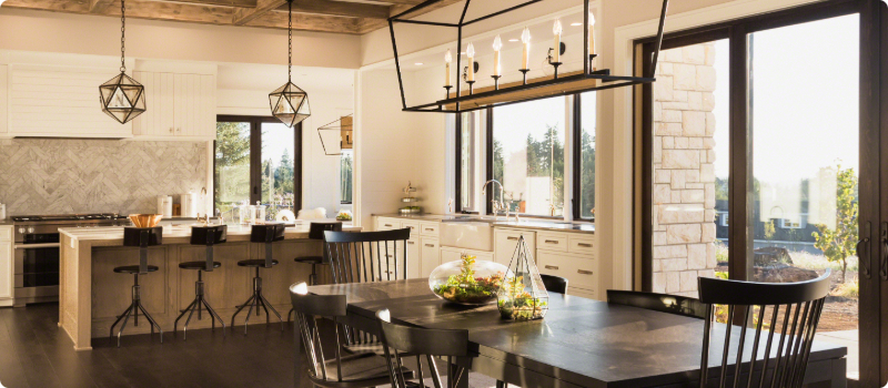 A new home kitchen and breakfast area with premium fixtures and furniture.