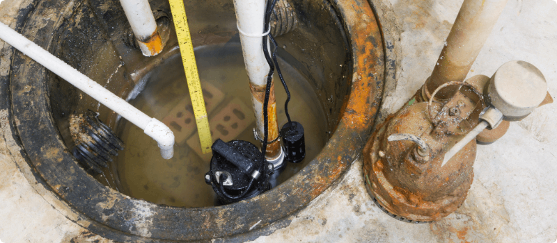 Old, rusty sump pump. 
