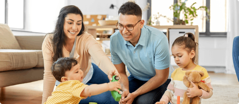 Small family playing together in their living room.