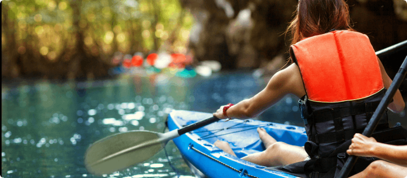 People kayaking on a lake.