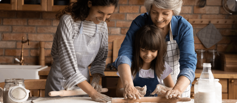A family cooking together in the kitchen.