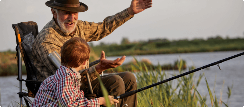 Family fishing together on a dock.