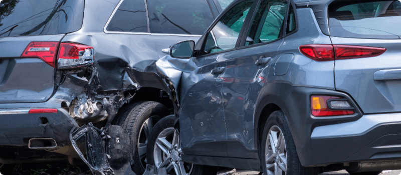 Two cars that have been in an accident.