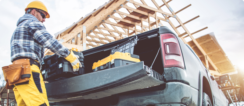 a contractor removing tools from a truck
