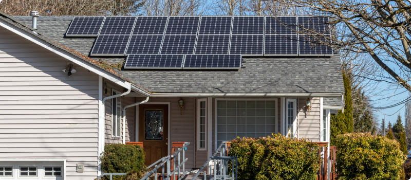 a home with solar panels on the roof