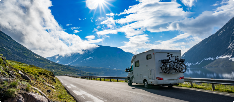 an RV driving along a mountain road