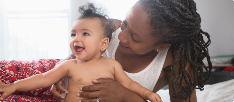 a woman holding a baby