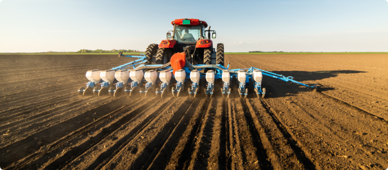 machinery planting seeds in a field