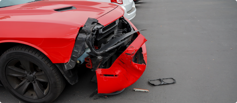 a car with damage in a parking lot