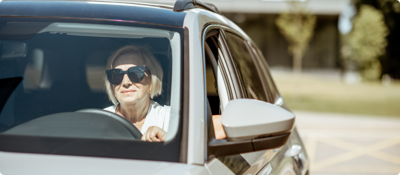a woman driving a car