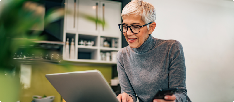a woman with a laptop and phone