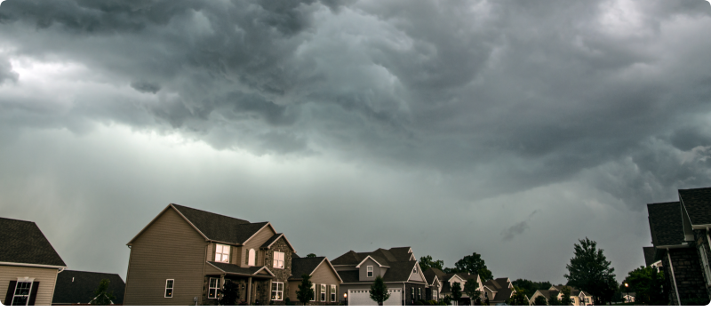 dark storm clouds over houses
