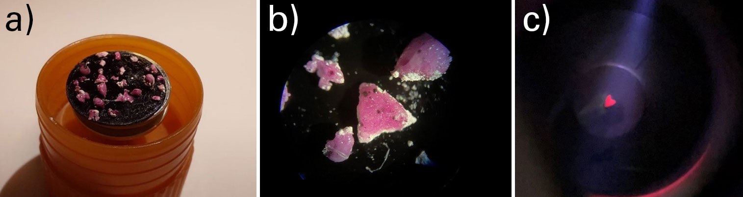 a) Various rubies mounted on a carbon tape. b) Detailed view of the rubies under an optical microscope. c) Fluorescing ruby in an argon ion beam in the PECS II using stationary single beam from one side.