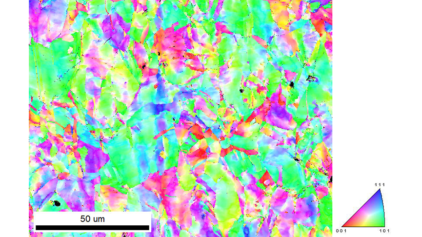 An IPF orientation map collect from a 134 µm x 104 µm area of the pressed coin with a 100 nm step size. The coloring is relative to the orientations aligned with the sample’s surface normal direction.