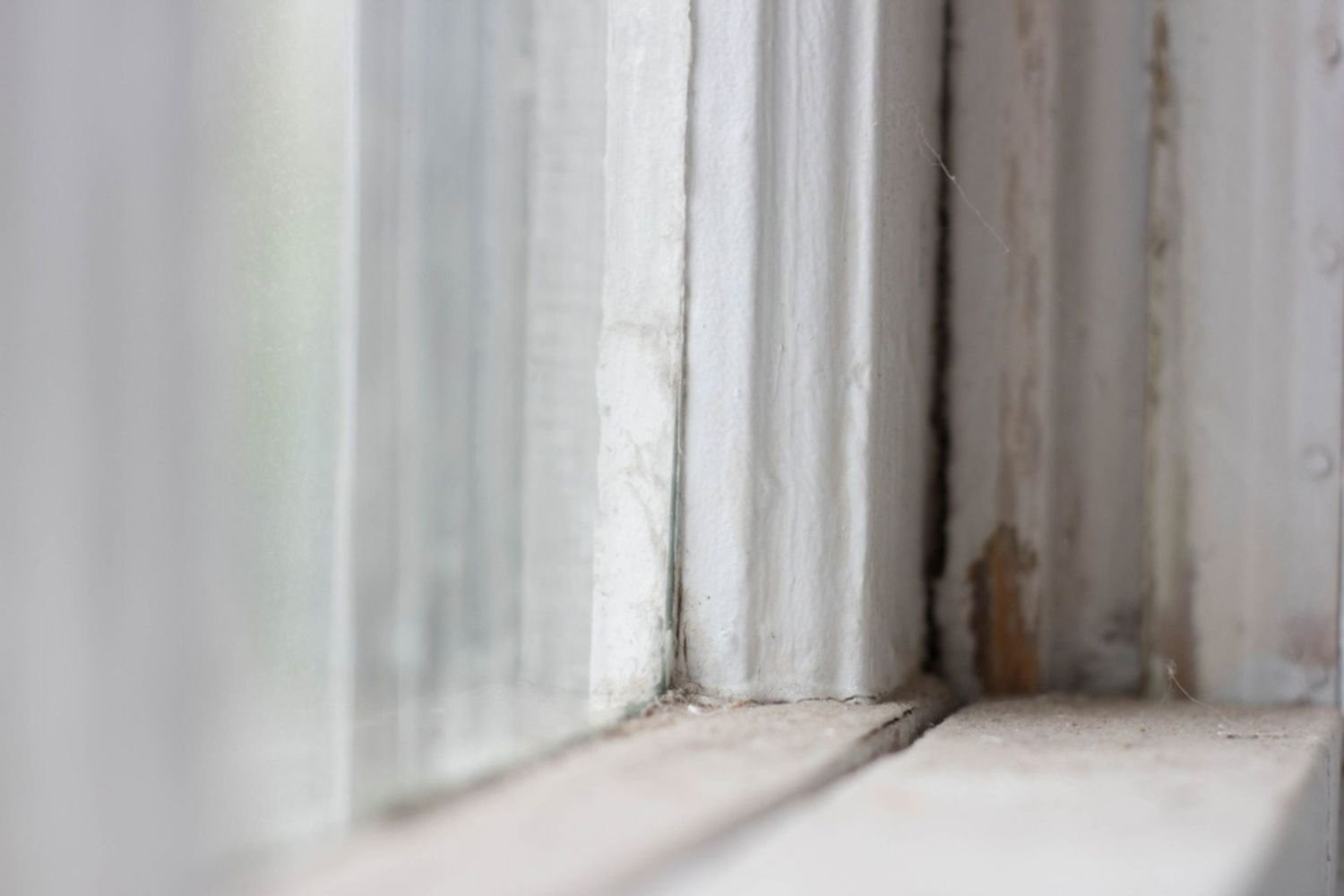 Upclose shot of a damaged window sill.