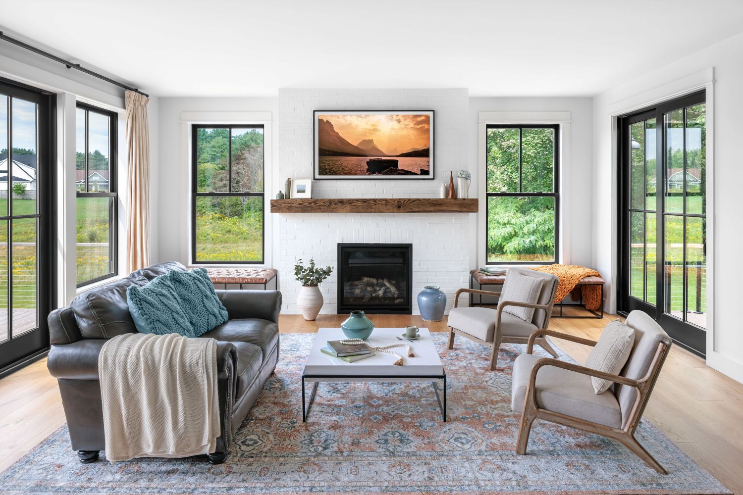 Interior shot of a room with large black windows