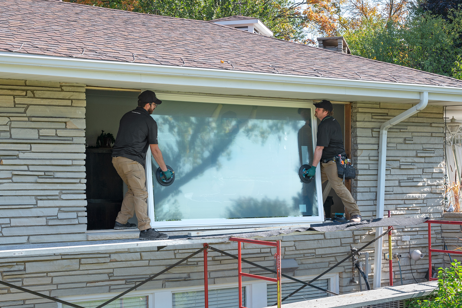 Renewal by Andersen installing a new window