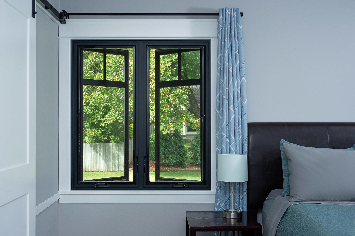 Renewal by Andersen casement window in a basement bedroom