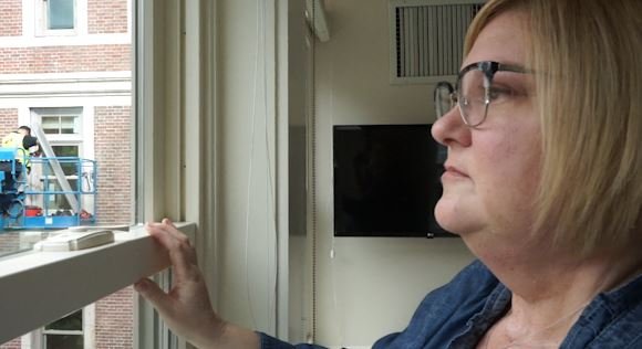 Lisa looking out a window