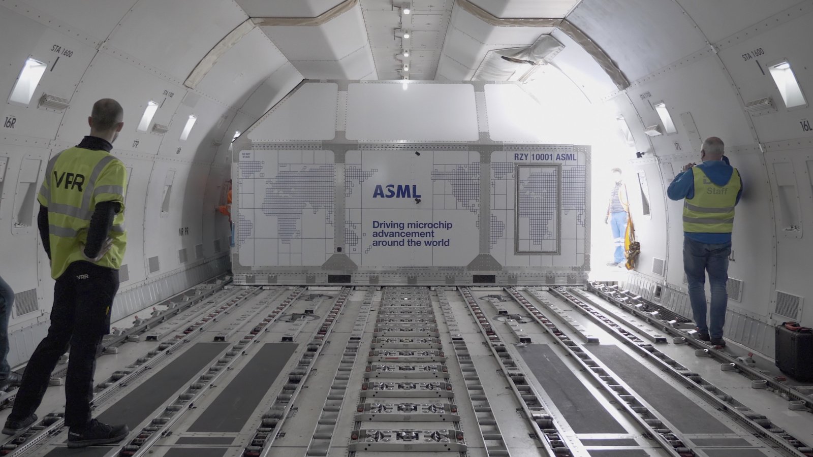 ASML container with parts of a lithography system is loaded into a cargo plane.