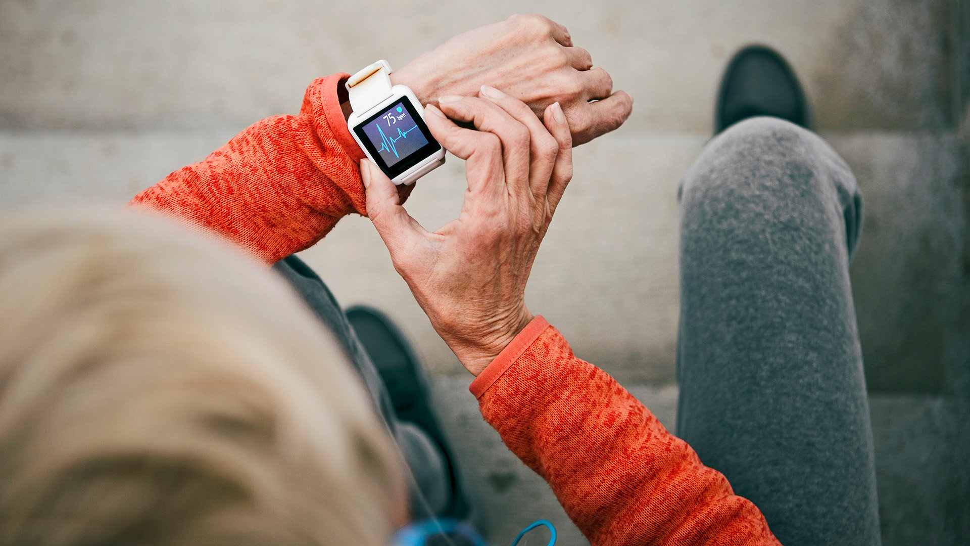 Person looking at heartbeat graph on a smart watch