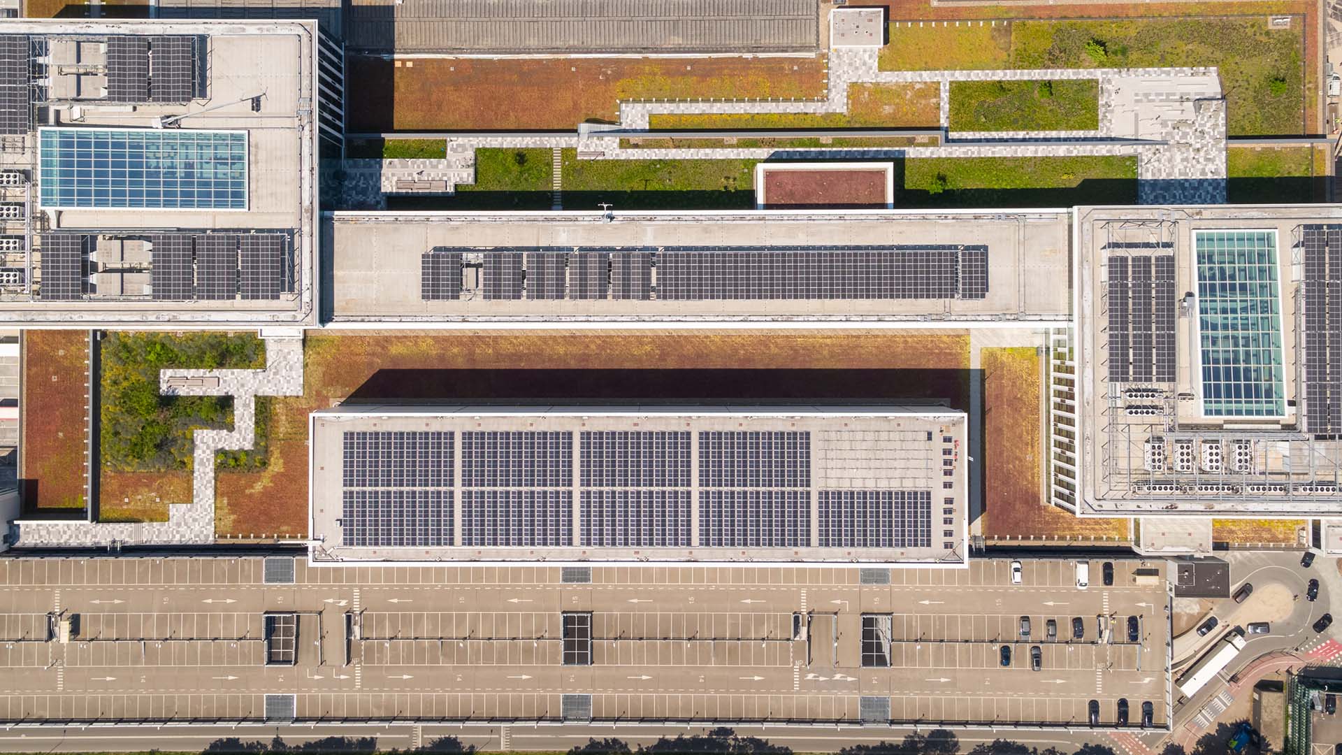 Ariel view of Building 6 KLM featuring a rooftop garden and solar panels. 