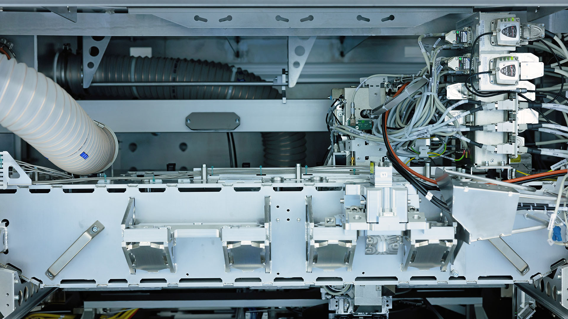 Interior view of ASML's YieldStar system showcasing the intricate machinery and circuitry. 