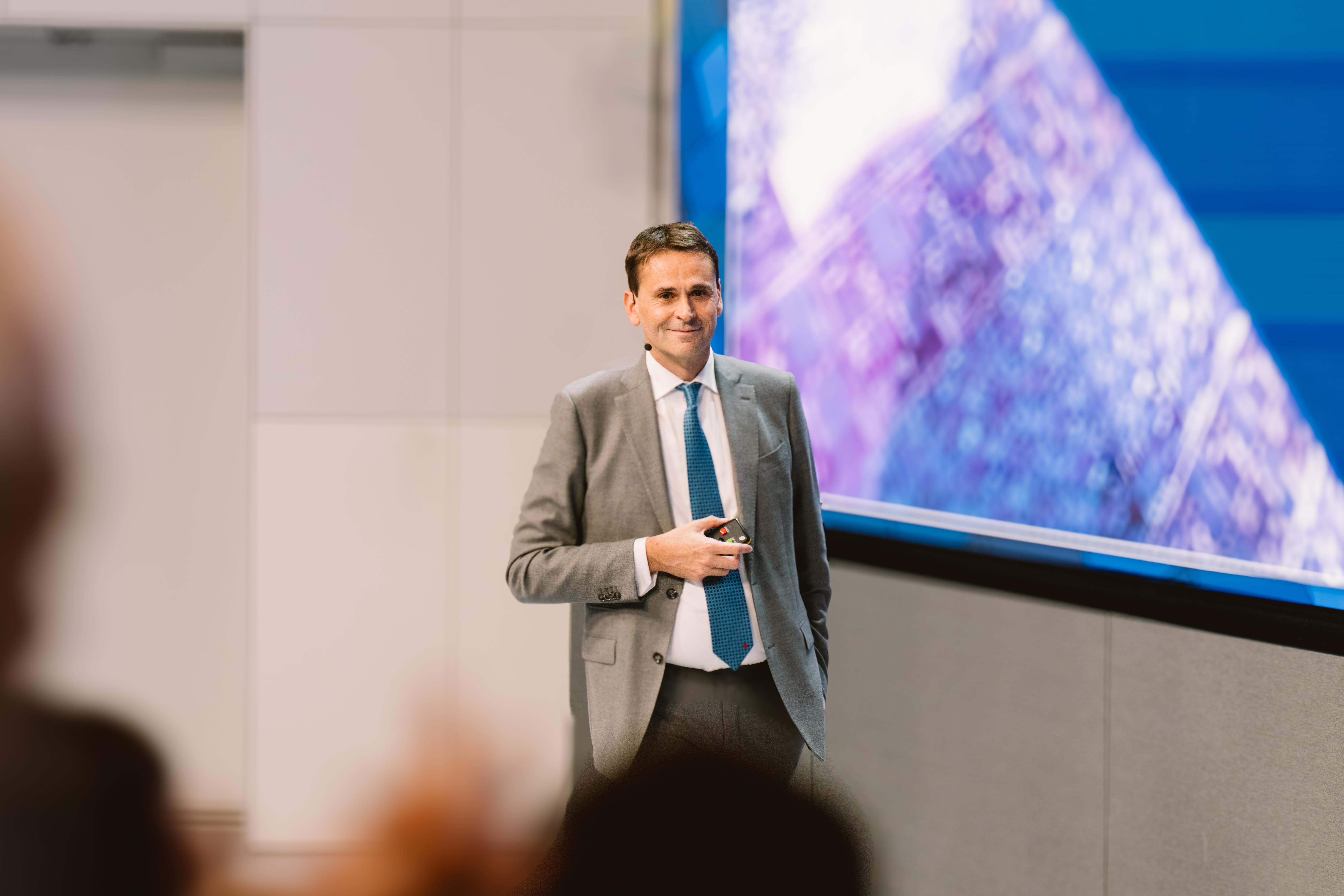 ASML CEO Christophe Fouquet presenting on stage