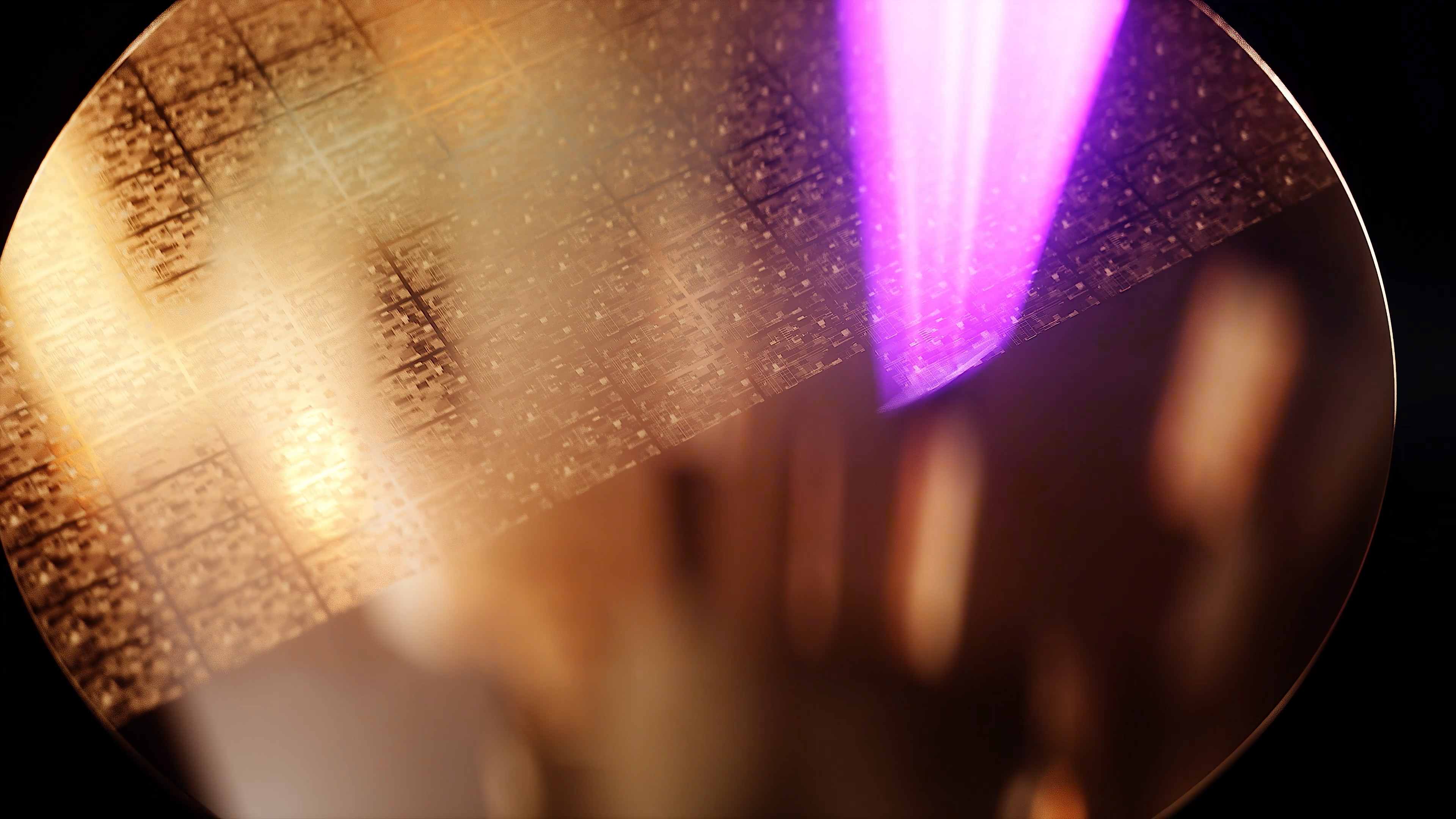 Close‑up of semiconductor chip patterns on a wafer surface Close‑up of semiconductor chip patterns on a wafer surface