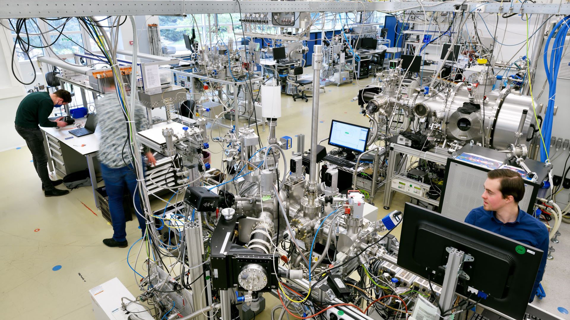 Technicians working with advanced equipment Technicians working with advanced equipment