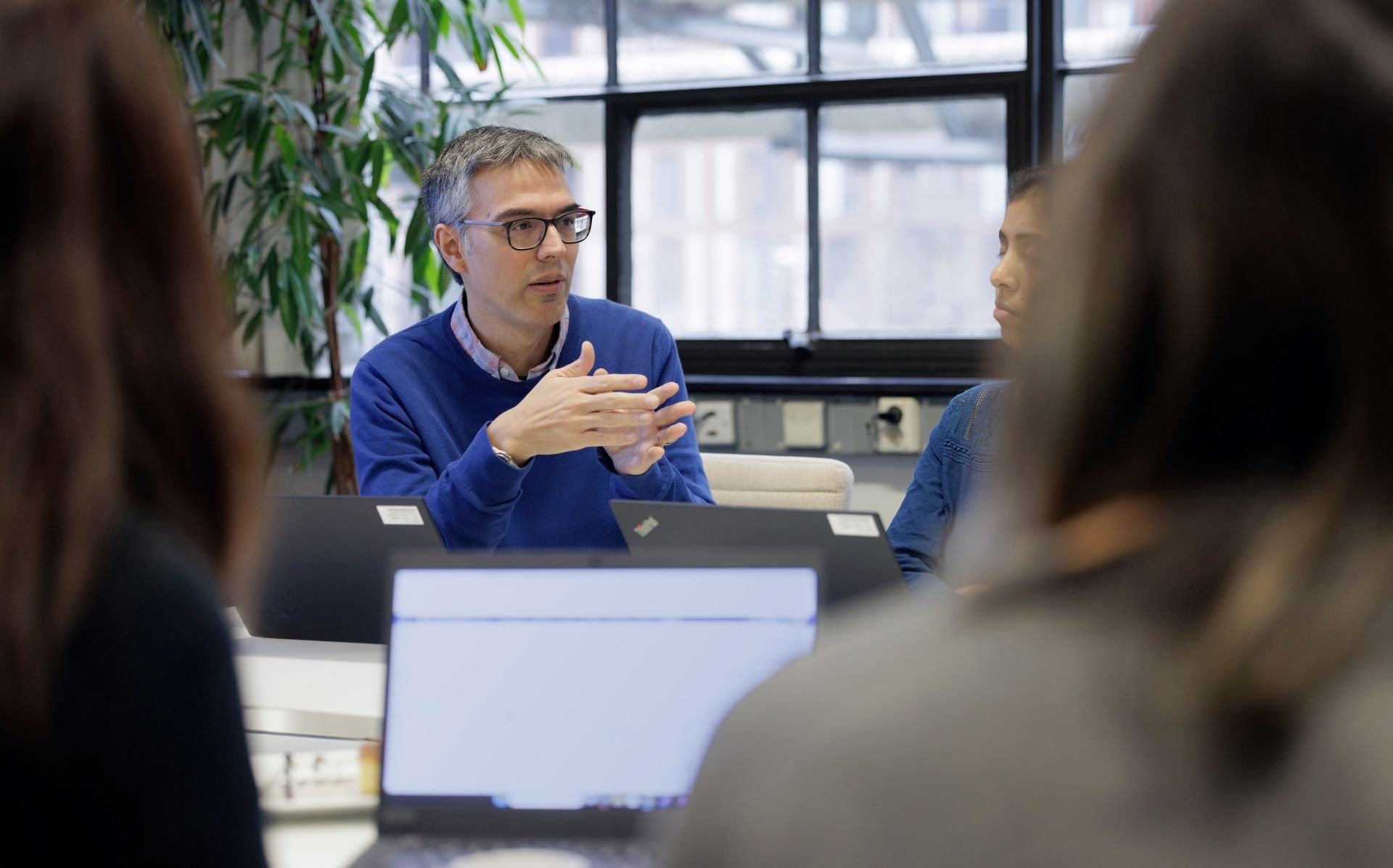 Group discussion around a table Group discussion around a table