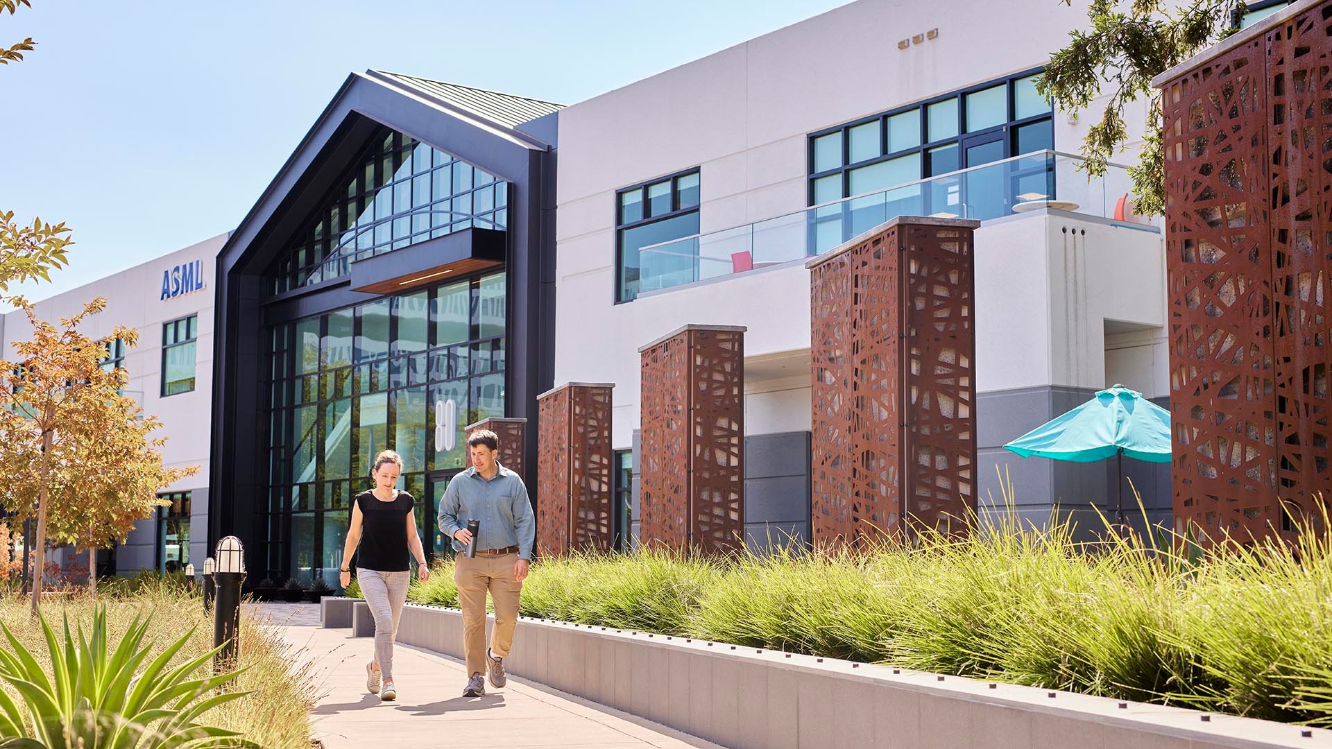 Employees walking in front of new Silicon Valley building