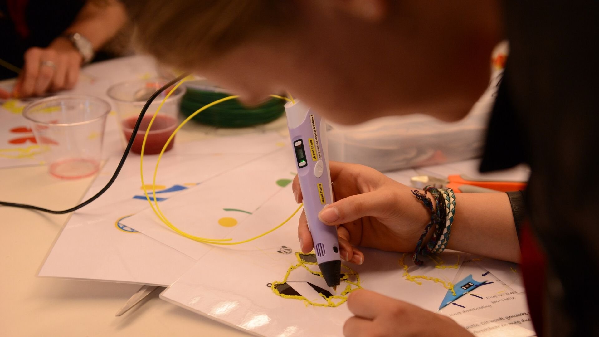 A teenager uses technology for crafts at ASML's annual Girls Day in Veldhoven, the Netherlands