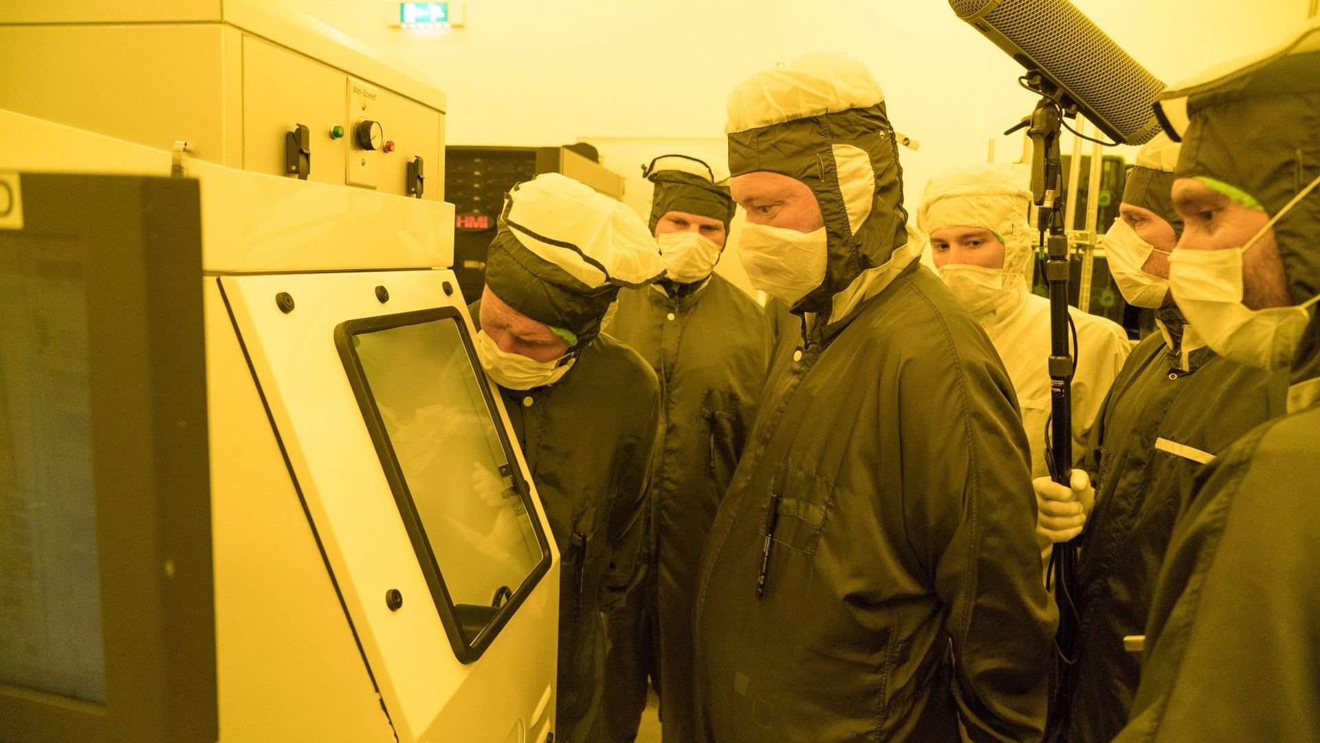 Cleanroom technicians inspect the wafer containing the Guiness World Record-holding smallest advertisement at ASML in Veldhoven, the Netherlands.
