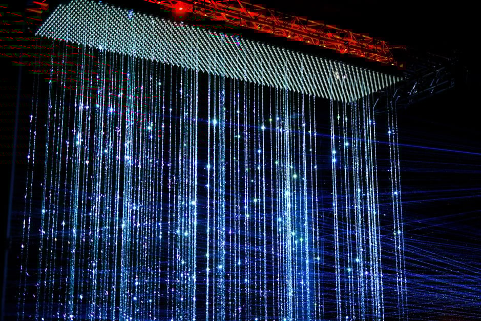 ASML’s commissioned piece for GLOW 2021, light falling in sparkling strings from the sky. 