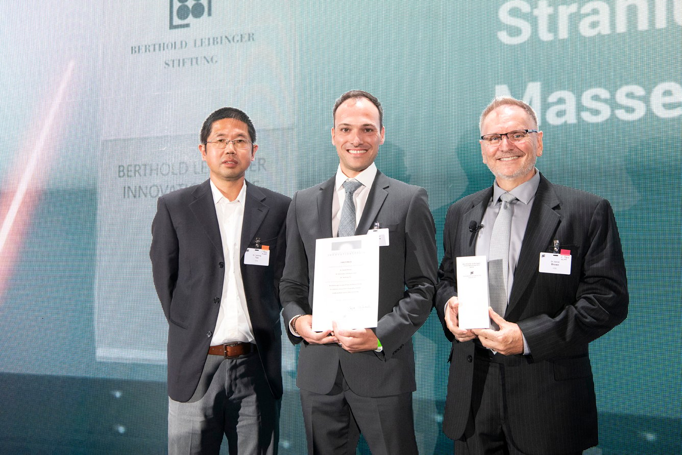 Three ASML employees who recieved the Leibinger Innovation Prize for the efforts in EUV light source development post for a photo at the award ceremony. 