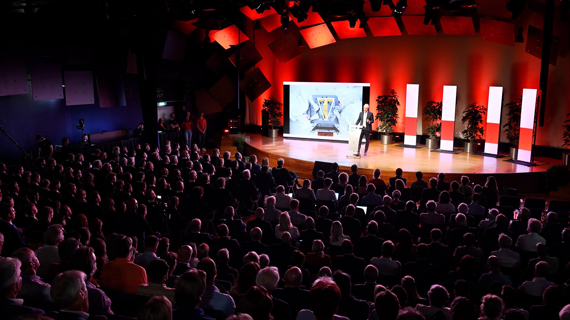 ASML’s CEO Peter Wennink speaks in front of a room full of guests at the Eindhoven University of Technology.