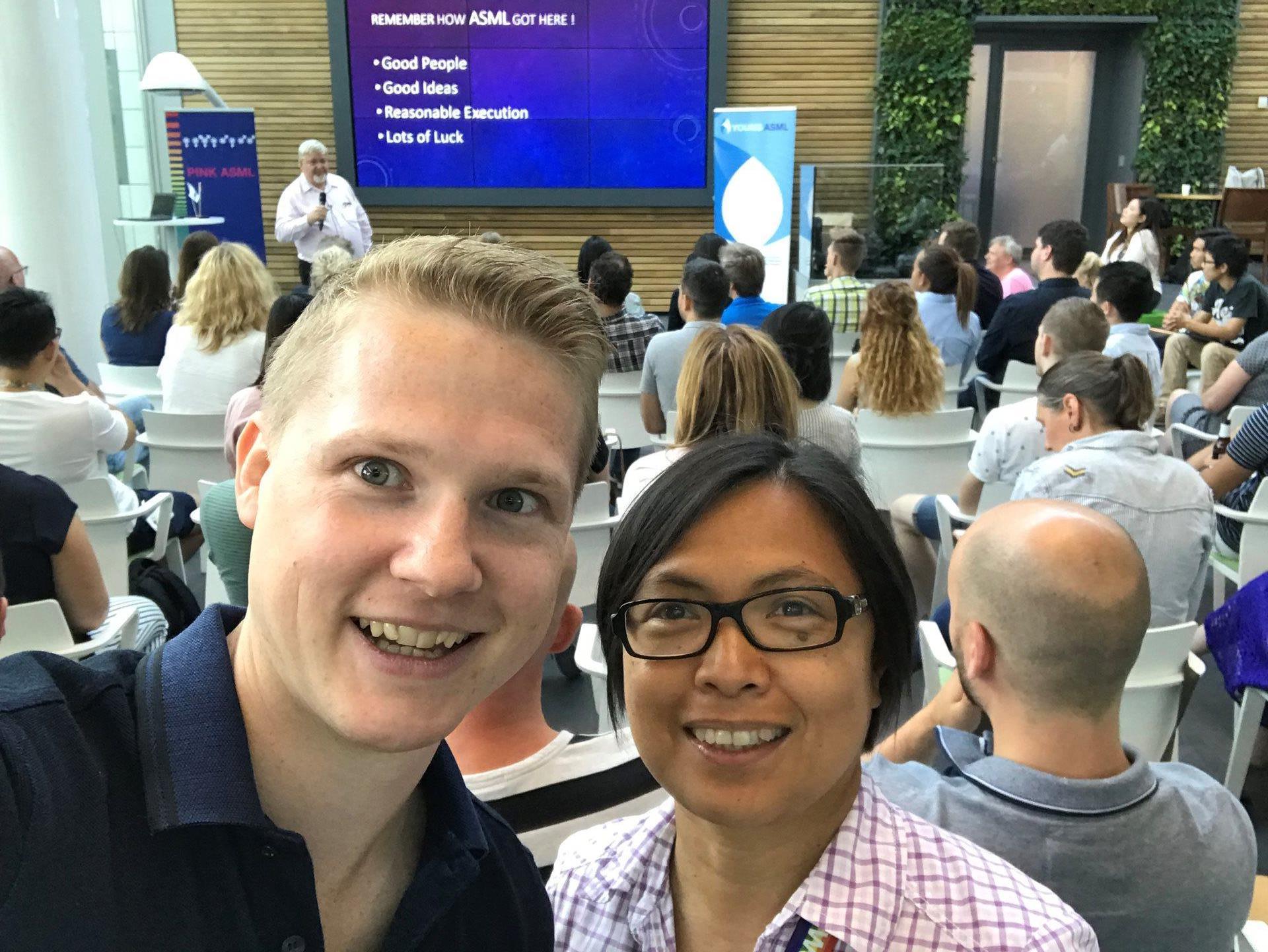 ASML employees pose during a small group meeting. 