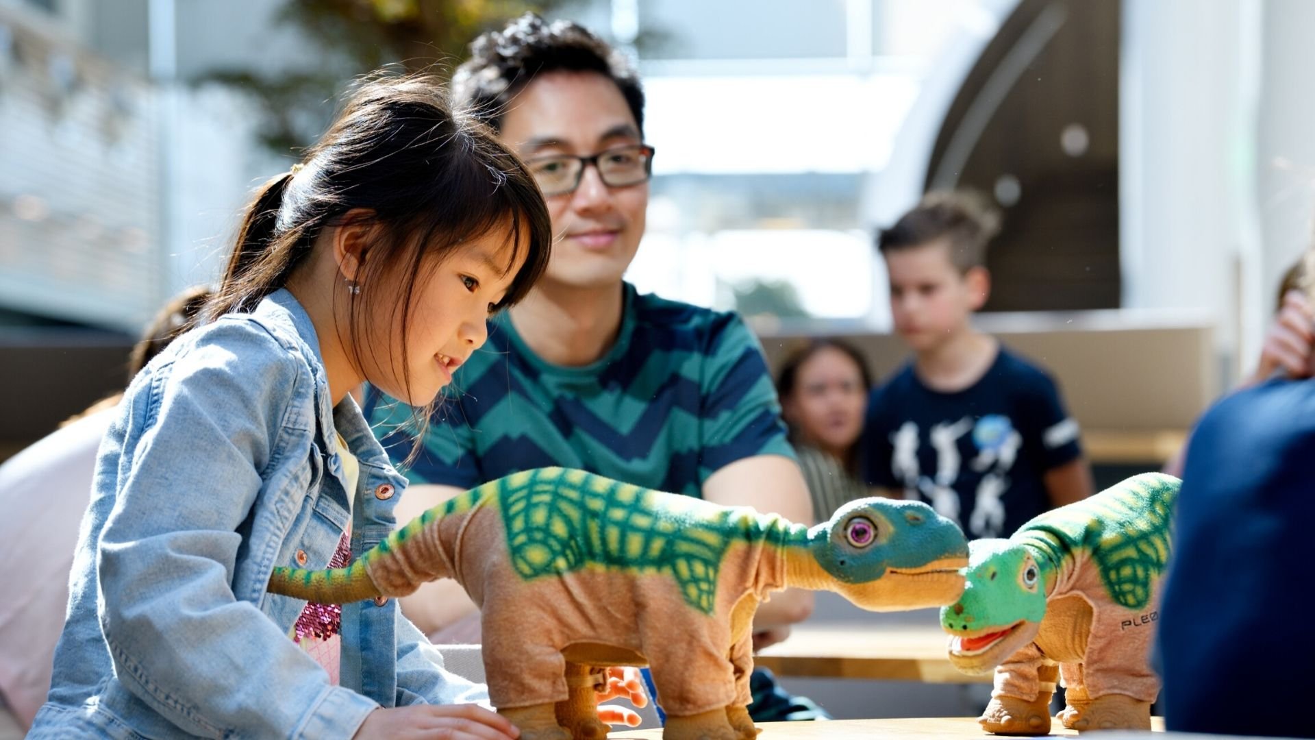 A child plays with dinosaurs during a family visit to ASML in Veldhoven, the Netherlands.