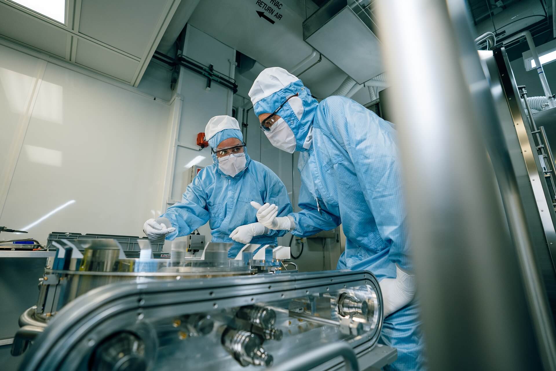 Two engineers working in a cleanroom