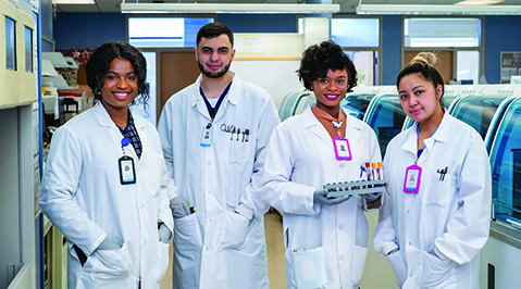 A group of four laboratorians